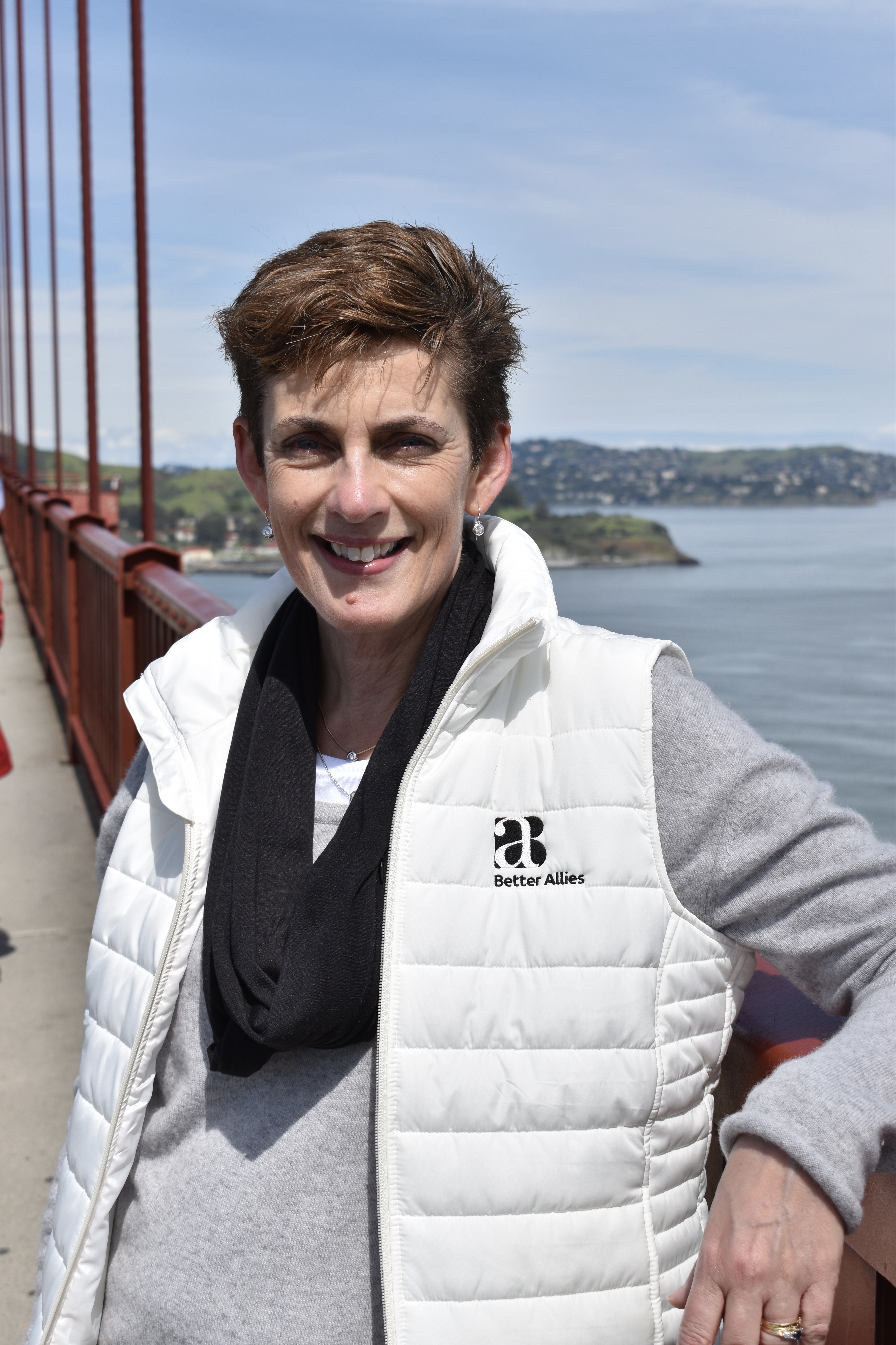 Photo of Karen wearing a Better Allies vest on the Golden Gate Bridge
